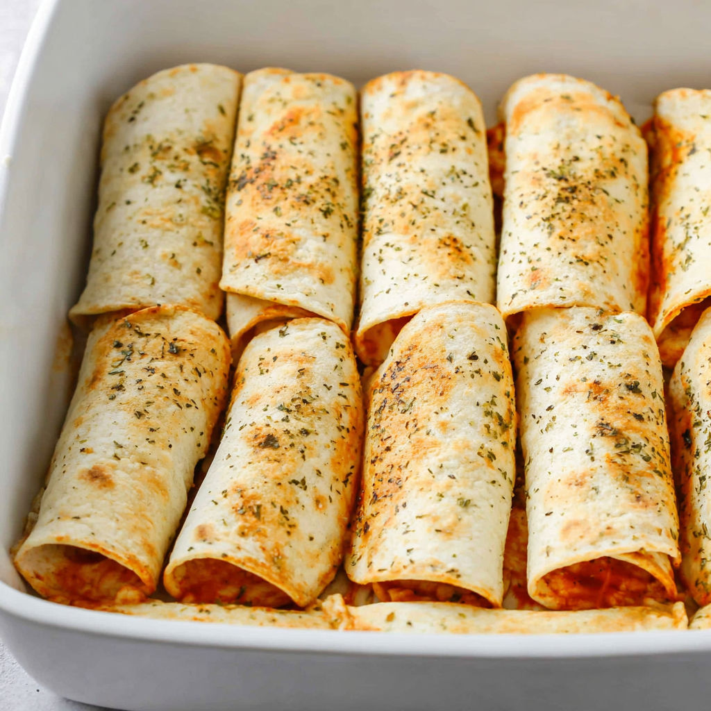 A pan of pizza roll ups.