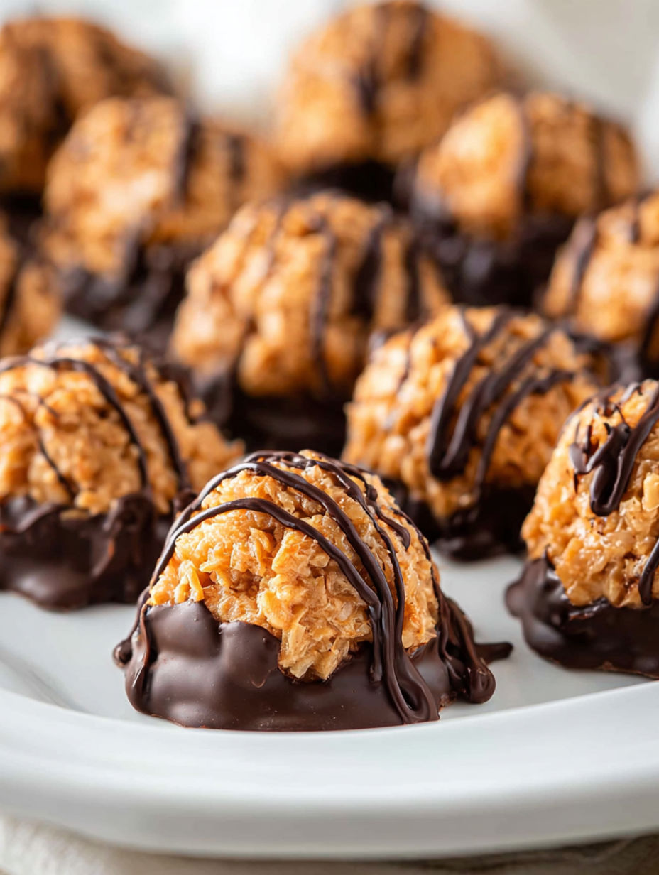 A plate of chocolate covered truffles.