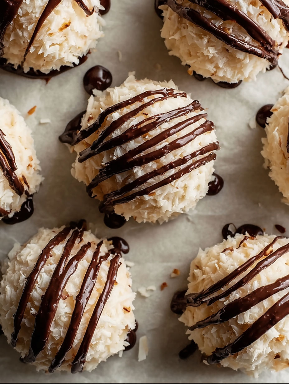 A close up of a coconut covered in chocolate.
