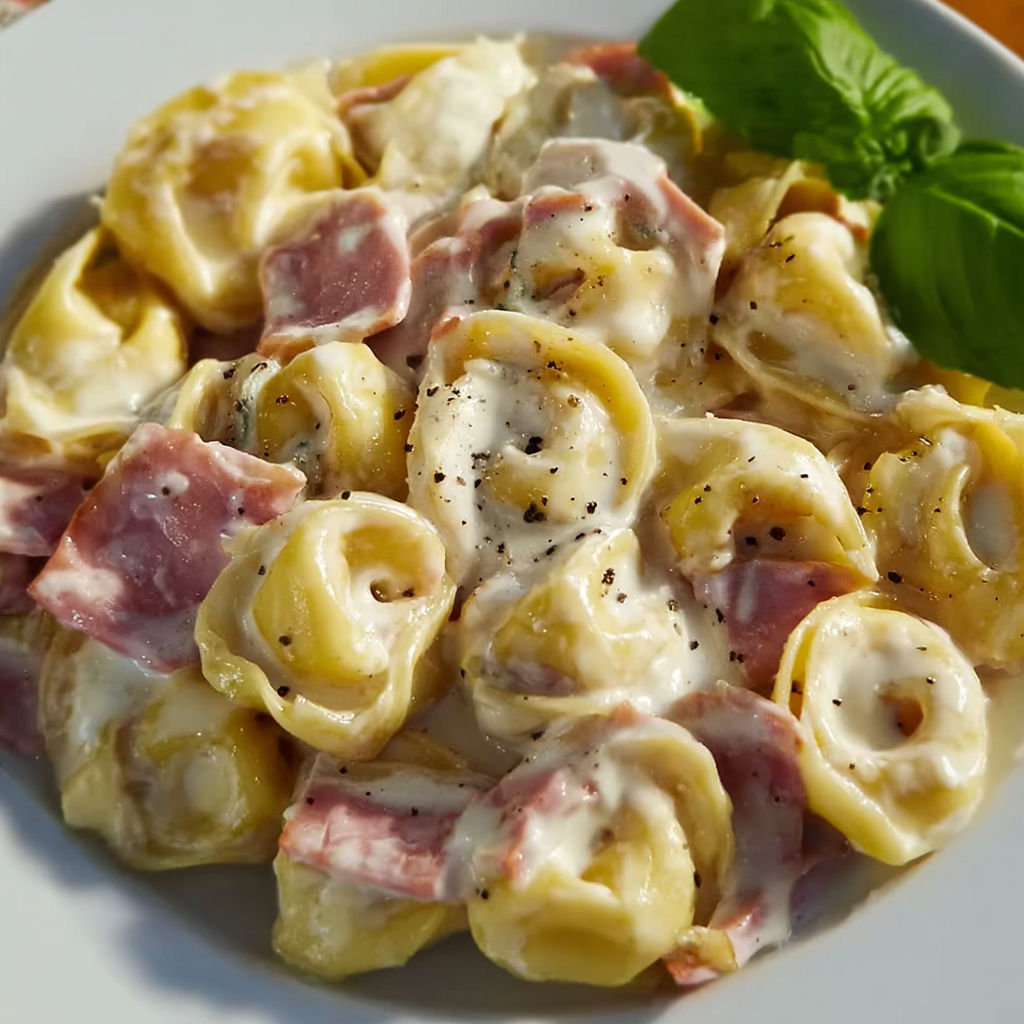 A plate of pasta with meat and cheese.