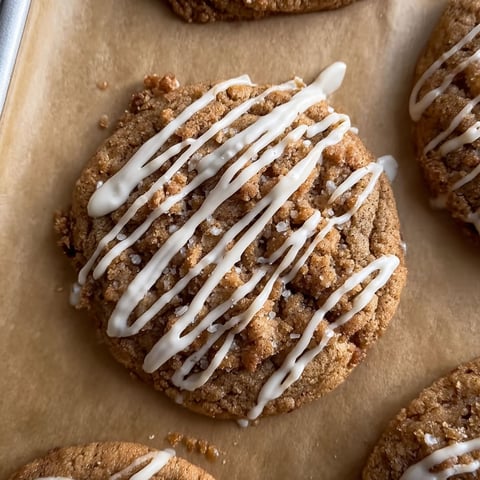 A close up of a cookie with white icing.