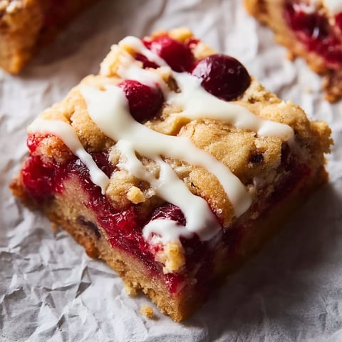 A slice of cranberry crumble pie bars.