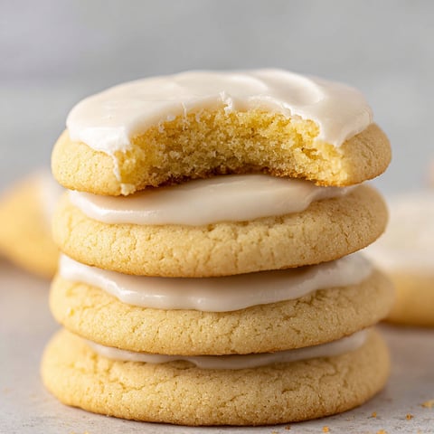 Almond Meltaway Cookies stacked on top of each other.