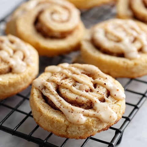 Cinnamon bun cookies on a cooling rack.