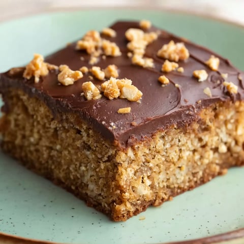 A slice of Nusskuchen on a plate.