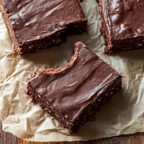 A piece of chocolate coconut date bars.