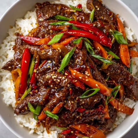 A bowl of meat and vegetables.