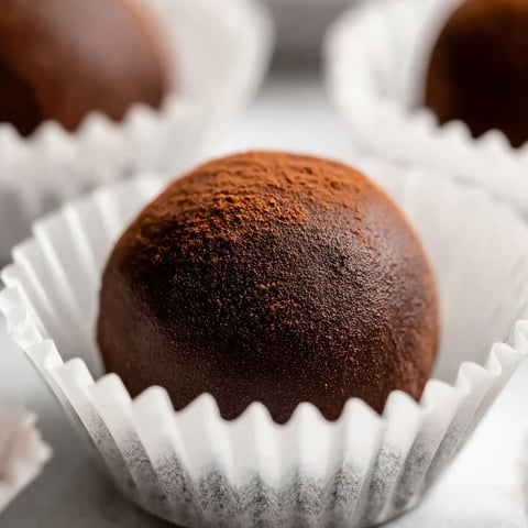 A chocolate truffle with orange and cinnamon flavors.