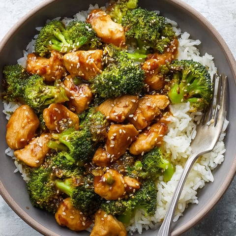 A bowl of chicken and broccoli.