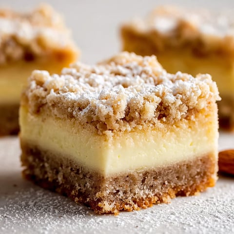 A close up of a cookie bar with almond marzipan.