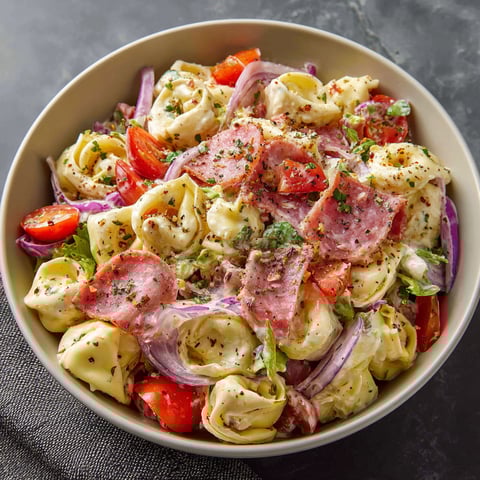 A bowl of Italian Grinder Tortellini Salad.