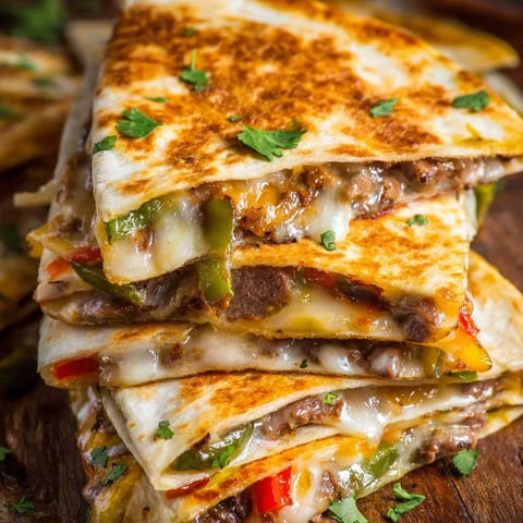 A stack of Philly Cheesesteak Quesadilla.
